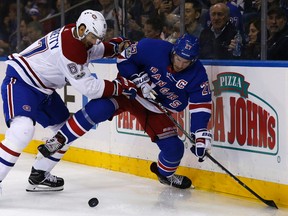 Montreal Canadiens Max Pacioretty (67) fights for the puck with New York Rangers' Ryan McDonagh (27) in the first period of an NHL hockey game Sunday, Oct. 8, 2017, in New York. (AP Photo/Adam Hunger)