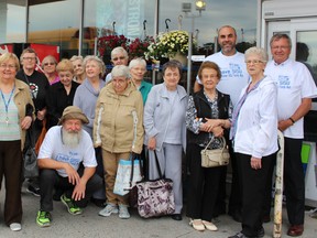 Supplied photo
Every Wednesday, seniors who do not have a readily available means of transportation anxiously await the arrival of the “grocery bus” at Finlandia Village. Gino Rocca, store manager, Vrab’s Your Independent Grocer. has supported this initiative for many years. This activity supports the residents at Finlandia Village with their weekly grocery and errand run,  but more than that, has become a highly anticipated social outing where neighbours are able to meet neighbours, and engage in their daily living with the support of much needed transportation. Back row second from right, Rocca is joined by Paul Villgren, director,  Finlandia SISU Foundation, and many thankful residents from Finlandia Village. Kiitos!