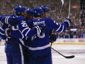 Toronto Maple Leafs Dominic Moore  scores the first goal of the game in the first period against the New York Rangers in Toronto on Saturday October 7, 2017. (Jack Boland/Toronto Sun)