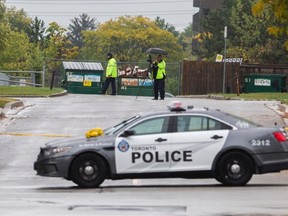 Toronto Police at the scene of a triple shooting outside Kingsview Village Junior School that left one man dead, on Monday, Oct. 9, 2017. (Ernest Doroszul/Toronto Sun)