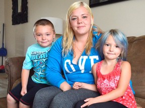 Kayla Mizon, centre, was walking in east St. Thomas with her fiance and their children Tyson, left, and Aliyah, right, when they found a backpack left at a bus stop. Quick thinking stopped Tyson from opening the backpack and good thing, as it was filled with syringes and other drug paraphernalia. (Louis Pin/Times-Journal)