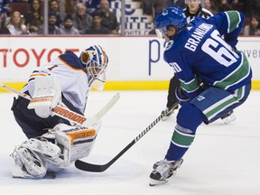 Goalie Laurent Brossoit #1 of the Edmonton Oilers stops Markus Granlund #60 of the Vancouver Canucks in NHL action on October, 7, 2017 at Rogers Arena in Vancouver, British Columbia, Canada.