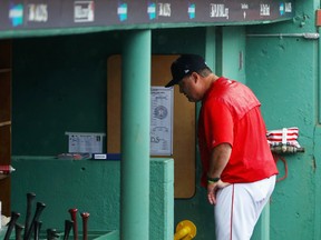 Manager John Farrell of the Boston Red Sox walks through the dugout after being ejected from Game 4 of the American League Division Series against the Houston Astros at Fenway Park on Oct. 9, 2017. (Maddie Meyer/Getty Images)