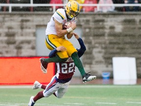 Edmonton Eskimos' Brandon Zylstra makes a catch as Montreal Alouettes' Greg Henderson defends during first half CFL football action in Montreal, Monday, October 9, 2017.