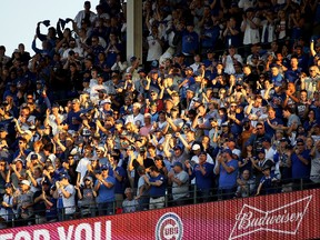 Fans cheer in the seventh inning during game three of the National League Division Series between the Washington Nationals and the Chicago Cubs at Wrigley Field on Oct. 9, 2017. (Jonathan Daniel/Getty Images)