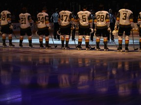 The Vegas Golden Knights stand attended for the national anthem before the NHL game against the Arizona Coyotes at Gila River Arena on Oct. 7, 2017. (Christian Petersen/Getty Images)