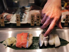 A chef serves sushi at a restaurant in Tokyo, Tuesday, April 23, 2013. As these fearless foodies come of age, they are giving the restaurant industry plenty to chew on. THE CANADIAN PRESS/AP-Itsuo Inouye