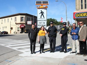 Members of the community came together at the new crosswalk at the corner of Albert Street and Rattenbury Street last week for a pedestrian crossover awareness event. Pictured (from left) County Engineer and Director of Operations Steve Lund, Huron County Health Unit Public Health Promoter and CHIP member Laura Edgar, Constable James Stanley of Huron County OPP (also a member of CHIP), Acting Staff Sergeant Wendy Burrow of Huron County OPP, Clinton Optimist member Dennis Krysak, Huron County Warden and Central Huron Mayor Jim Ginn.
