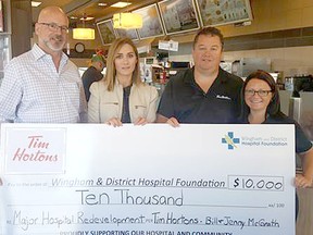 Tim Hortons Wingham and Blyth have pledged a $10,000 donation to the Wingham & District Hospital Foundation campaign. L-R: Mark Foxton - Fundraising Committee Chair and Nicole Jutzi - WDH Foundation Coordinator, accept the donation from Bill McGrath and Jenny McGrath, owners of Tim Hortons.