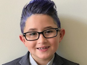 In this undated photograph provided by Dana Sinno, shows Luca Sinno, a Florida third-grader was sent home from school on picture day because he broke dress code by having blue hair. (Dana Sinno via AP)