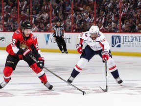 Mike Hoffman of the Ottawa Senators skates with the puck against Devante Smith-Pelly of the Washington Capitals in the first period at Canadian Tire Centre on Oct. 5, 2017. (Jana Chytilova/Freestyle Photography/Getty Images)