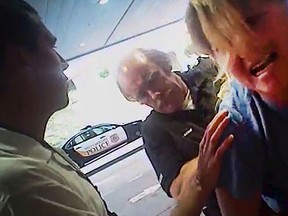 In this July 26, 2017, frame grab from video taken from a police body camera and provided by attorney Karra Porter, nurse Alex Wubbels is arrested by Det. Jeff Payne at University Hospital in Salt Lake City. (Salt Lake City Police Department/Courtesy of Karra Porter via AP, File)