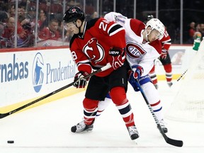 New Jersey defenceman Damon Severson signed a six-year contract last month. He pairs with captain Andy Greene. (JULIO CORTEZ/AP files)