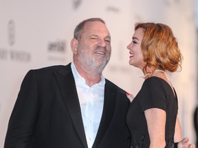 Harvey Weinstein is seen with Lindsay Lohan in a file photo. (John Rainford/WENN.com)