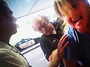 In this July 26, 2017, file frame grab from video taken from a police body camera and provided by attorney Karra Porter, nurse Alex Wubbels is arrested by a Salt Lake City police officer at University Hospital in Salt Lake City. The case of the police officer caught on video dragging Wubbels from the hospital in handcuffs is now before a Utah police chief to decide possible punishment after a law enforcement oversight board found the detective lost control and got aggressive while his supervisor failed to seek legal advice that could have calmed the situation. (Salt Lake City Police Department/Courtesy of Karra Porter via AP, File)