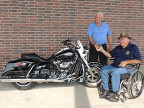 From the right, Glen McLachlan, 65, gives the keys to the winner of the Vanastra and District Lions Club and Vanastra Recreation Centre Harley Davidson Draw, Harvey Livingston. McLachlan is believed by many to be a man that’s a key factor in the event’s success. (Submitted photo)
