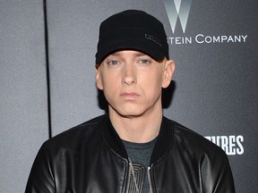 In this July 20, 2015, file photo, Eminem attends the premiere of "Southpaw" in New York. Eminem has released a verbal tirade on President Donald Trump in a video that aired as part of the BET Hip Hop Awards on Oct. 10, 2017. (Photo by Evan Agostini/Invision/AP, File)