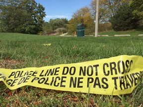 Police tape lies on Ganatchio Trail east of Riverdale Avenue, near the Little River Pollution Control Plant, in Windsor, Ontario on October 8, 2017. (Nick Brancaccio/Windsor Star)