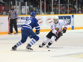 Nick Suzuki of the Owen Sound Attack, right, skates in on Thomas Harley of the Mississauga Steelheads looks on in Ontario Hockey League action at the Harry Lumley Bayshore Community Centre on Saturday, September 30, 2017 in Owen Sound, Ont.  (Postmedia Network)