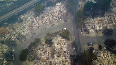 This aerial image shows a neighborhood that was destroyed by a wildfire in Santa Rosa, Calif., Tuesday, Oct. 10, 2017. Newly homeless residents of California wine country took stock of their shattered lives Tuesday, a day after deadly wildfires destroyed homes and businesses. (Nick Giblin/DroneBase via AP)
