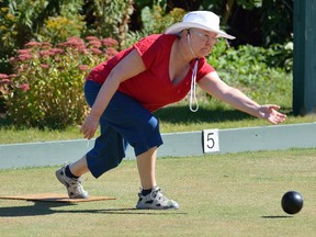 Karen Shearer, a member of the Fairmont Lawn Bowling Club, throws a ball on the last day of operation before the club closed its doors after 102 years of operation. (MORRIS LAMONT, Postmedia Network)
