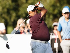 Edmonton Oilers alumni Grant Fuhr tees off during the Syncrude Oil Country Championship at Windermere Golf and Country Club in Edmonton on Aug. 3, 2017. (Ian Kucerak /Postmedia)