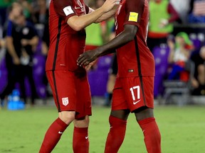 Michael Bradley and Jozy Altidore of United States celebrate winning the 2018 FIFA World Cup Qualifying match against Panama at Orlando City Stadium on Oct. 6, 2017. (Mike Ehrmann/Getty Images)