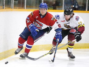 Noah Serre of the Rayside Balfour Canadians and James Redmond of the Timmins Rock battle for the puck during the NOJHL Showcase 2017 at the Gerry McCrory Countryside Sports Complex in Sudbury, Ont. on Tuesday October 10, 2017. Gino Donato/Sudbury Star/Postmedia Network