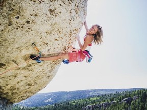 In this undated photo provided by Louis Arevalo, Inge Perkins climbs Cowboy King in Wild Iris, Wyo. Gallatin County sheriff's officials say Perkins was skiing with her boyfriend Hayden Kennedy on Imp Peak on Oct. 7, 2017, when they triggered an avalanche in a steep, narrow gulley. Perkins was buried by the 150-foot-wide slide. Kennedy, who was partially buried, pulled himself free and hiked out for help after he couldn't find his girlfriend. (Louis Arevalo via AP)