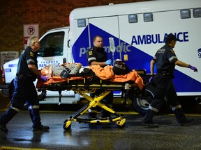 An elderly man arrives at hospital after being struck by a car at the intersection of Old Park Rd. and  Wembley Rd., near Bathurst St. and Eglinton Ave., around 7:30 p.m. Wednesday. (VICTOR BIRO/Special to the Sun)