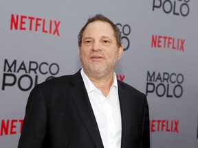 In this Dec. 2, 2014, Harvey Weinstein attends the season premiere of the Netflix series "Marco Polo" in New York. Weinstein faces multiple allegations of sexual abuse and harassment from some of the biggest names in Hollywood. (Photo by Andy Kropa/Invision/AP, File)