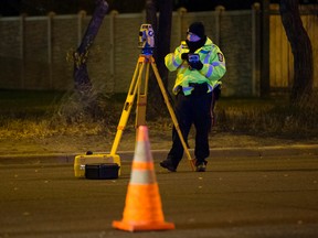 Police work at the scene of an accident involving a car and a pedestrian along 87 Avenue at 169 Street in Edmonton on Wednesday, Oct. 11, 2017.  
David Bloom