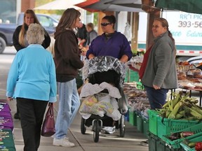 TIM MEEKS/THE INTELLIGENCER
The Belleville Farmers' Market has been in operation for nearly 200 years.  Vendors who purchase produce at the Ontario Food Terminal in Toronto — Canada's largest wholesale market — are not welcome in the Market Square. "It's all about local farmers helping local farmers," says veteran vendor Jackie Tapp, of Picton (at right).