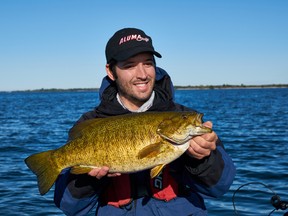 Angler Eric Riley holds a Lake Ontario smallmouth bass. (Submitted photo)