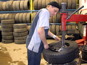 Maurice Thibeault is seen in this January 2016 Postmedia file photo working as a tire technician at Brooks Tire in Chatham. A former colleague there described him as "laid back" as a war over a $6-million winning Lotto 6/49 ticket brews.