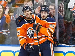 Darnell Nurse #25 and Leon Draisaitl #29 of the Edmonton Oilers celebrate Draisaitl's goal against the Winnipeg Jets at Rogers Place on October 9, 2017 in Edmonton, Canada.