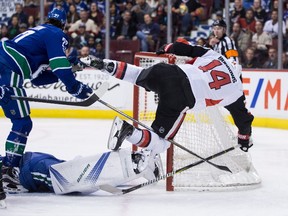 Ottawa Senators' Alex Burrows falls over the net after being stopped by Vancouver Canucks goalie Jacob Markstrom during NHL action in Vancouver on Oct. 10, 2017. (THE CANADIAN PRESS/Darryl Dyck)