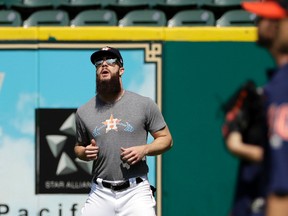 Houston Astros pitcher Dallas Keuchel warms up during baseball practice on Oct. 11, 2017. (AP Photo/David J. Phillip)