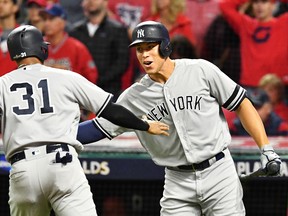 Aaron Hicks of the New York Yankees celebrates with Aaron Judge in the ninth inning against the Cleveland Indians in Game 5 of the American League Divisional Series at Progressive Field on Oct. 11, 2017. (Jason Miller/Getty Images)