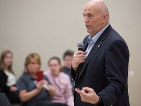 Sen. Vern White talks during a meeting at the Kanata Rec Centre organized by We The Parents, a local group that has pointed to an epidemic of opioid abuse in Ottawa's west end and says it has no choice but to launch its own treatment and prevention program. WAYNE CUDDINGTON / POSTMEDIA