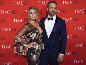 In this April 25, 2017 file photo, actress Blake Lively wears a Marchesa dress as she poses with her husband Ryan Reynolds at the TIME 100 Gala in New York. Marchesa co-founder Georgina Chapman took what some believed was her only brand-saving leap Tuesday, Oct. 10, 2017, as sex abuse allegations against her husband Harvey Weinstein mounted. Breaking her six-day silence, she told People she was leaving the film mogul she married in 2007. The divorce revelation came as some on social media called for a Marchesa boycott. (Photo by Charles Sykes/Invision/AP, File)