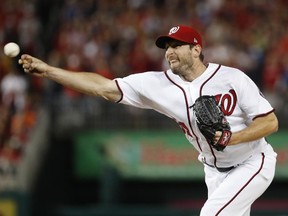 Washington Nationals relief pitcher Max Scherzer throws during the fifth inning in Game 5 of baseball's National League Division Series against the Chicago Cubs, at Nationals Park, Thursday, Oct. 12, 2017, in Washington. (AP Photo/Alex Brandon)
