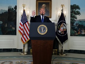 President Donald Trump speaks on Iran policy from the Diplomatic Reception Room of the White House, Friday, Oct. 13, 2017, in Washington. (AP Photo/Evan Vucci)