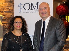 Dr. Nadine Yammine, district chair of District 1 of the Ontario Medical Association, welcomes OMA president Dr. Shawn Whatley, who was in Chatham on Oct. 11 to meet with area doctors to discuss what the impacts will be on healthcare if the federal Liberal implements proposed federal tax changes.