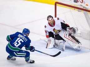 Ottawa Senators' Craig Anderson stops Vancouver Canucks' Derek Dorsett during NHL action in Vancouver on Oct. 10, 2017. (THE CANADIAN PRESS/Darryl Dyck)