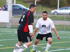 Sudbury Regional Competitive Soccer League over 40 division players from the Caruso and RPG teams battle for the ball during semi-final action from James Jerome Field in Sudbury, Ont. on Thursday, October 12, 2017. Gino Donato/Sudbury Star/Postmedia Network