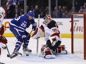 Connor Brown can't get the puck by Cory Schneider as the Toronto Maple Leafs host the New Jersey Devils at the Air Canada Centre in Toronto on Oct. 11, 2017. (Michael Peake/Toronto Sun/Postmedia Network)