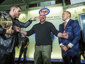 Ahead of their big fight, UFC champ Michael Bisping and challenger Georges St. Pierre face off during a press conference held at the Hockey Hall of Fame in Toronto on Oct. 13, 2017. (Ernest Doroszuk/Toronto Sun/Postmedia Network)