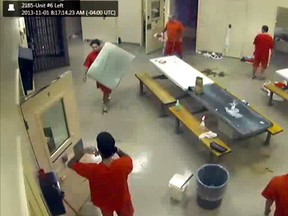 Video grab from Elgin-Middlesex Detention Centre showing Anthony George cleaning up the morning after Adam Kargus was killed.