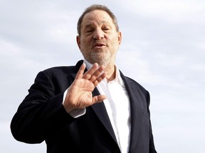 This file photo taken on October 5, 2015 shows Harvey Weinstein, US film producer and executive producer of the TV series "War and Peace", posing during a photocall at the MIPCOM audiovisual trade fair in Cannes, southeastern France. New York police said on October 12, 2017 they have reopened a investigation into allegations of a 2004 sexual assault by disgraced movie mogul Harvey Weinstein. An avalanche of claims of sexual harassment, assault and rape by the Hollywood heavyweight have surfaced since the publication last week of an explosive New York Times report alleging a history of abusive behavior dating back decades. (AFP PHOTO / VALERY HACHEVALERY HACHE/AFP/Getty Images)